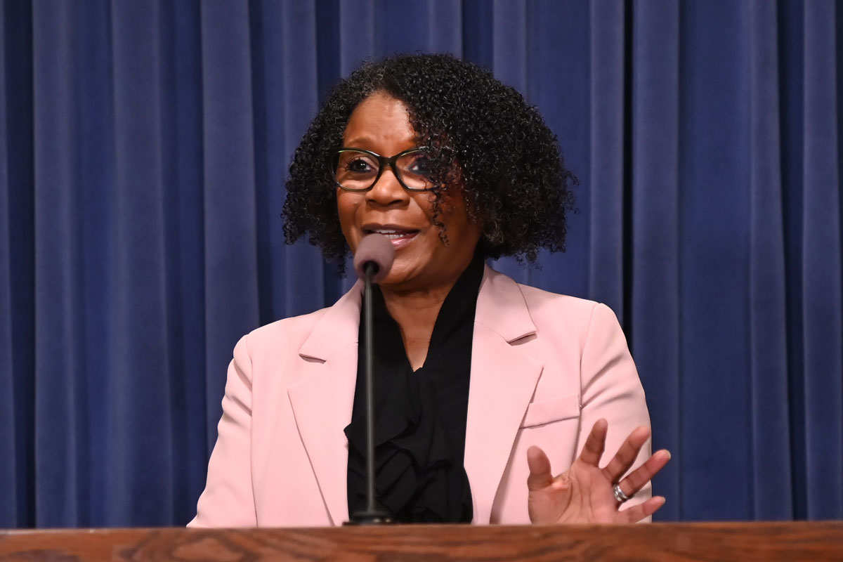 State Senator Adraine Johnson speaks at a podium